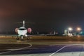 Private jet plane parked in the airport at night. Business travel concept Royalty Free Stock Photo