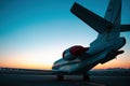 Private jet plane parking at the airport. Private airplane at sunrise. Early morning at airport apron.