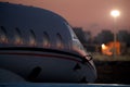 Private jet plane parking at the airport. Private airplane at sunrise. Early morning at airport apron.