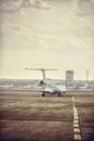 Private jet plane parking at the airport. Private airplane at orange sunset. Royalty Free Stock Photo