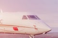 Private jet plane parking at the airport. Private airplane at sunset, Royalty Free Stock Photo