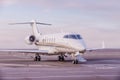 Private jet plane parking at the airport. Private airplane at sunset, Royalty Free Stock Photo