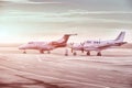 Private jet planes parking at the airport. Private airplanes at sunset, Royalty Free Stock Photo