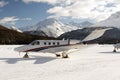 A private jet is ready to take off in the airport of St Moritz Switzerland in winter Royalty Free Stock Photo