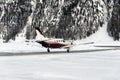 A private jet is ready to take off in the airport of St Moritz Switzerland in winter Royalty Free Stock Photo