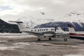 Private jets and a helicopter in the airport of St Moritz Switzerland Royalty Free Stock Photo