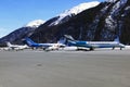 Private jets, planes and helicopters in the beautiful snow covered mountains of alps in St Moritz Switzerland Royalty Free Stock Photo