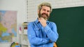 Private lesson. Back to school. Science concept. Mature bearded teacher in classroom. Study with interest. Man mentoring Royalty Free Stock Photo