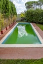 Pool with cloudy green water due to the presence of algae and dirt