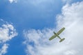 Private propeller plane in blue sky.