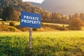 Private property information signboard in countryside meadow landscape