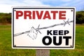 Private property keep out sign on a fence. Royalty Free Stock Photo