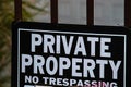 Private property no tresspassing sign printed in bold black and white letters Royalty Free Stock Photo