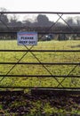 Private property please keep out printed sign on metal fence Royalty Free Stock Photo