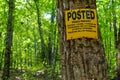 Private property posted sign in a forest