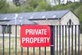 Private property red sign on entrance gate