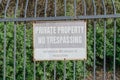 Private property sign on crooked fence