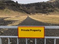 Private property sign on fence against the road and land Royalty Free Stock Photo