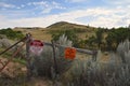 Stop and Private Property signs with rangeland in th4 Badlands of North Dakota