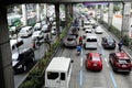 Private and public vehicles pass along a traffic congested major highway in Metro Manila