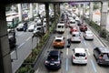 Private and public vehicles pass along a traffic congested major highway in Metro Manila