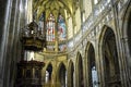 Private pulpit in Saint Vitus cathedral in Prague, Czechia with stained glass windows and many archways near the nave and chapel Royalty Free Stock Photo