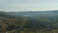 Houses in the suburbs. The railway. Mountain landscape, aerial view