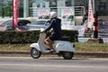Private Scooter Motorcycle, Man on Old Vespa