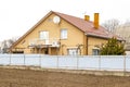 Private suburban house with back yard, balcony behind high fence. beautiful landscape recreation cottage complex in ecological Royalty Free Stock Photo