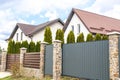 Private suburban house with back yard behind high fence. beautiful landscape recreation cottage complex in ecological area with Royalty Free Stock Photo