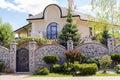 Private suburban house with backyard behind high fence. beautiful landscape recreation cottage complex in ecological area with Royalty Free Stock Photo