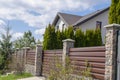 private suburban house with backyard behind high fence. beautiful landscape recreation cottage complex in ecological area with Royalty Free Stock Photo