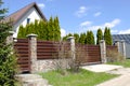 private suburban house with backyard behind high fence. beautiful landscape recreation cottage complex in ecological Royalty Free Stock Photo