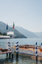 Private taxi boat moored by Bellagio Water Taxis Pier, Lake Como, Italy.