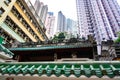 Hong Kong Apartment Buildings behind roof of old Temple, private tenements in Hong Kong, China Royalty Free Stock Photo