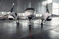 Private turbo-propeller airplane in hangar, nobody Royalty Free Stock Photo