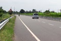 Private vehicles and traffic road sign walking on the national highway road Royalty Free Stock Photo