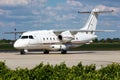 Private Wings Dornier 328 passenger plane at airport. Aviation and aircraft. Air transport and travel. Audi car factory Royalty Free Stock Photo