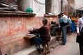 Private workers print documents on old typewriters outdoor in India