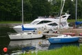 Private yachts, motorboats and boats moored at the old wooden pier. Royalty Free Stock Photo