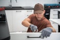 Pro Cabinetmaker Installing New Kitchen Furnitures Royalty Free Stock Photo