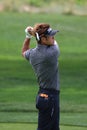 Pro Golfer Michio Matsumura watches his ball