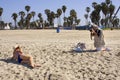 Pro Photographer Working With Models On The Beach Royalty Free Stock Photo