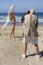 Pro photographer working with models on the beach Royalty Free Stock Photo