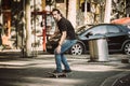 Pro skateboarder ride skateboard on capital road street through