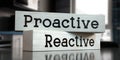Proactive, reactive - words on wooden blocks Royalty Free Stock Photo