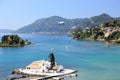 Plane approaching Corfu airport over Vlacherna monastery. Kanoni peninsula, Corfu island, Ionian Sea, Greece.