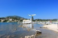 Plane approaching Corfu airport over Vlacherna monastery. Kanoni peninsula, Corfu island, Ionian Sea, Greece.