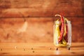 Probiotics food background. Pickled hot pepper chili in glass jars on wooden white background. Copy space Royalty Free Stock Photo