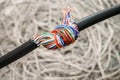 Problem concept with internet connection. Stranded telecommunications cable is twisted into a knot. The damaged cable is entangled Royalty Free Stock Photo